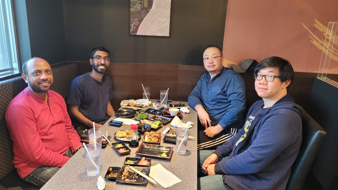 Calvin enjoying a plate of sushi at a restaurant